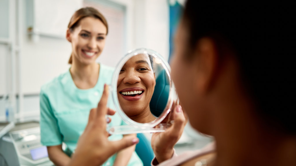Smiling female dental patient during office visit